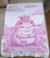 Pink and white jacquard baby blanket with the frog princess design
