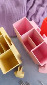 Pink and yellow tool organizers with compartments